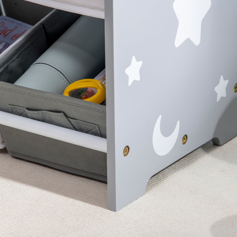 Children's bed with star and moon design, open drawer revealing toys.