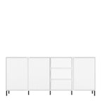 A modern white storage cabinet with three tall ribbed doors on the left and right, and three drawers in the center, supported by slim black legs against a plain white background.