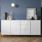 White sideboard against a blue wall with decorative items.