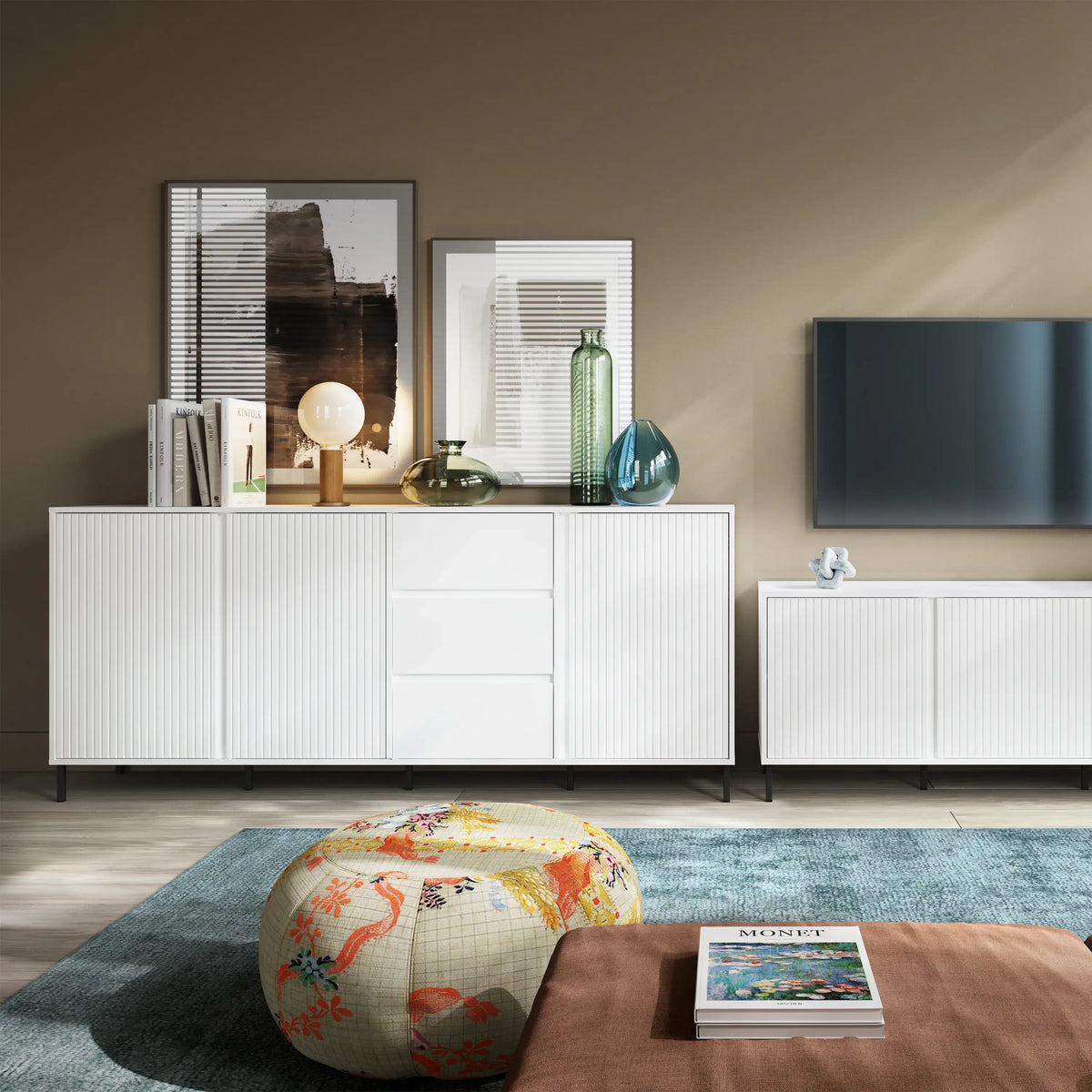 Modern living room with white sideboard, TV, and decorative items.