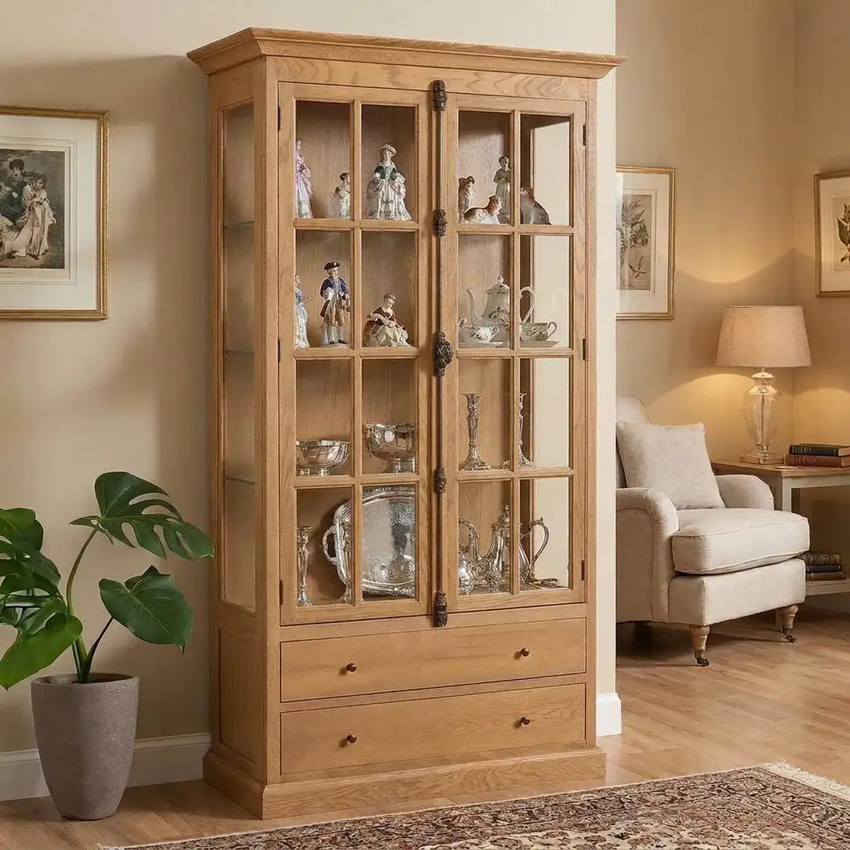 A wooden cabinet with medium brown wood grain, in a lounge setting displaying ornaments.