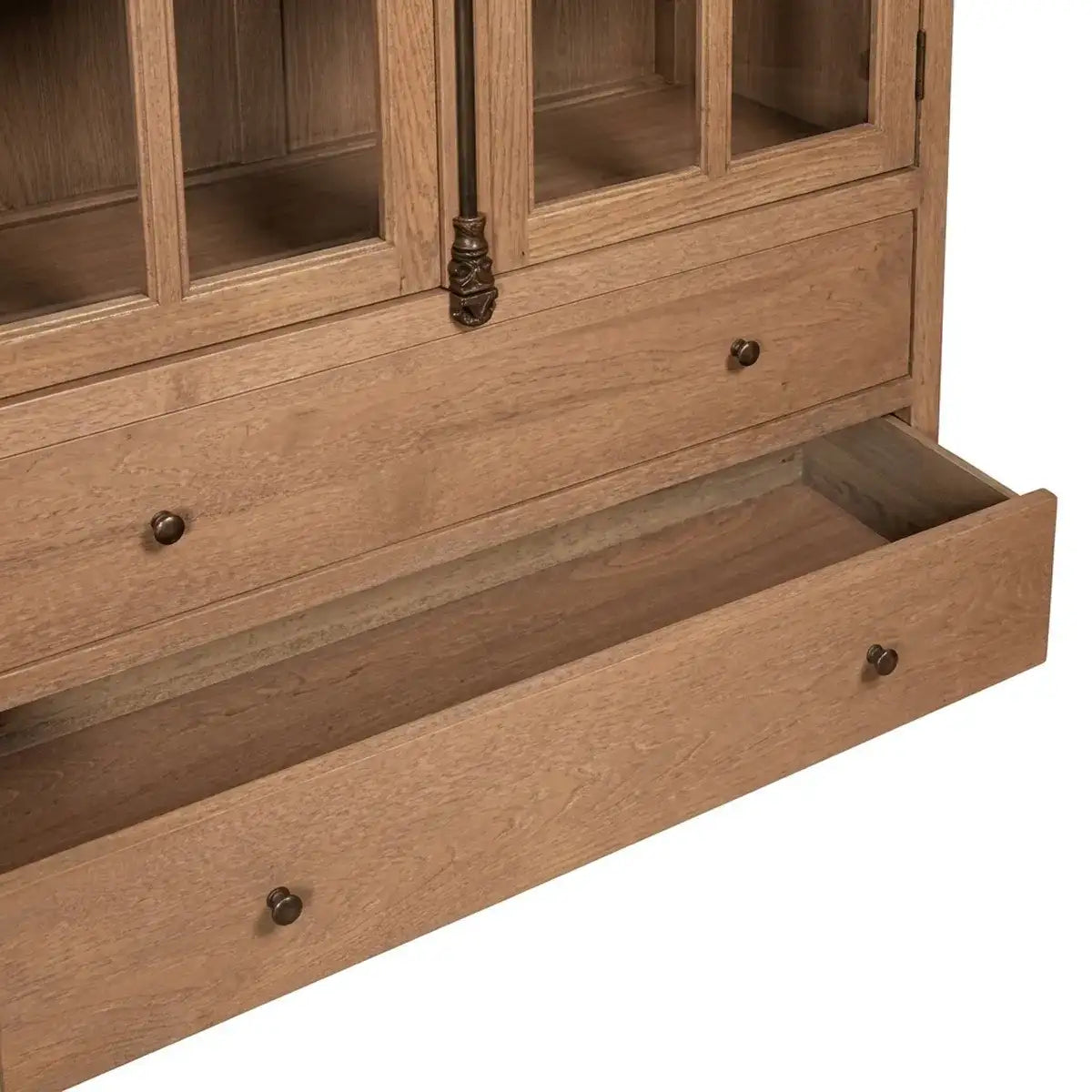 Close-up of a wooden cabinet or hutch with glass upper doors and a pulled-out bottom drawer, shown on a plain white background.