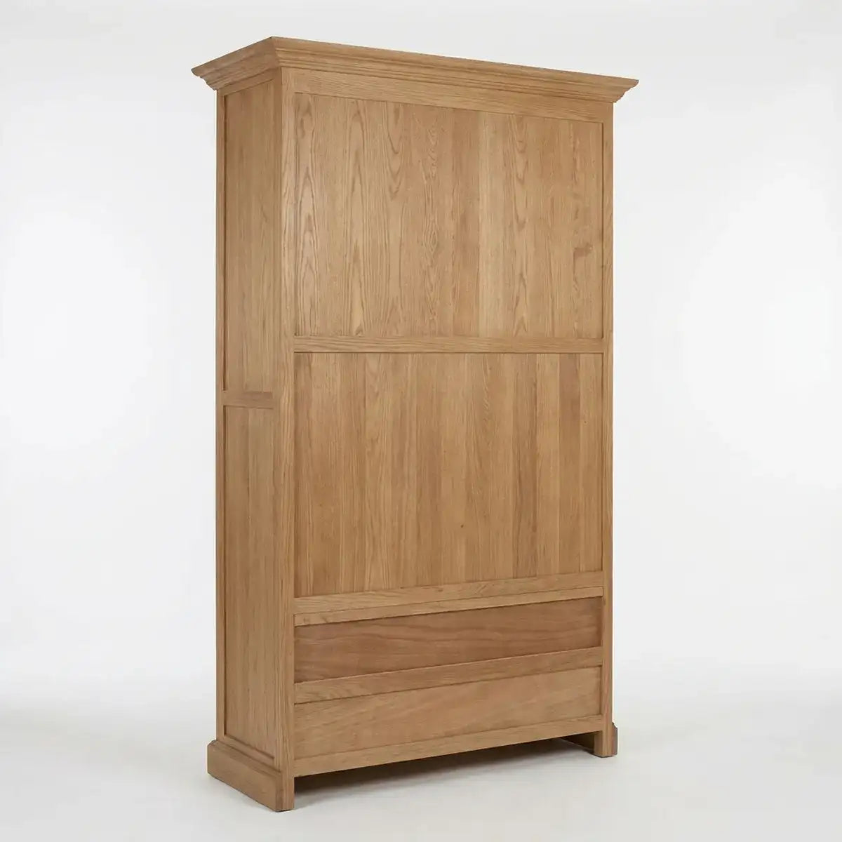 A tall wooden wardrobe or armoire with a natural oak finish, featuring two upper doors and a lower drawer, shown against a plain white studio background.