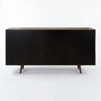 A mid-century modern sideboard or credenza in dark stained wood, featuring a rectangular body, tapered legs, and a light wood top, photographed against a plain white studio background.