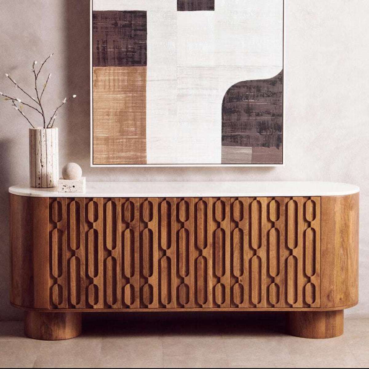 Wooden console table with decorative elements in a room setting