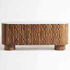 Wooden console table with decorative elements in a room setting