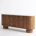 Wooden console table with decorative elements in a room setting