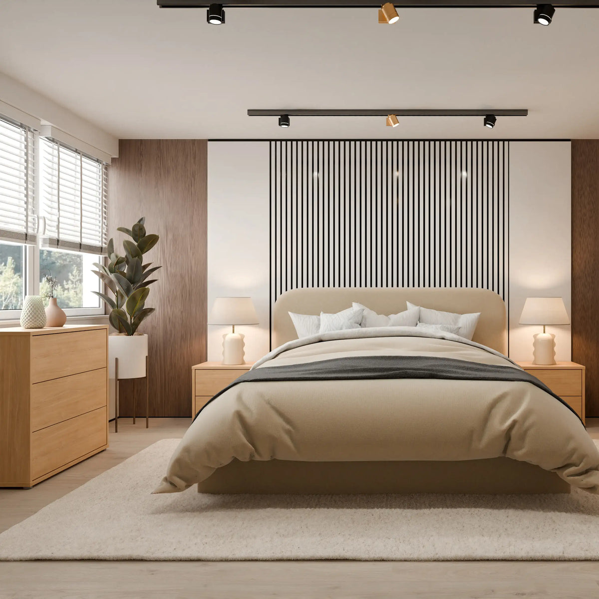 A modern bedroom featuring a beige upholstered bed centered against a black-and-white vertically striped accent wall. The room includes light wood nightstands, matching lamps, a wood dresser, a potted plant, and a large light rug on a pale wood floor.
