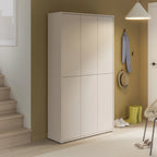 White wardrobe against a wall with a staircase and light fixture in a room.