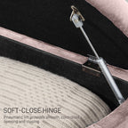 Close-up of a soft-close hinge mechanism on a piece of furniture.