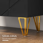 Black cabinet with gold steel legs on a wooden floor
