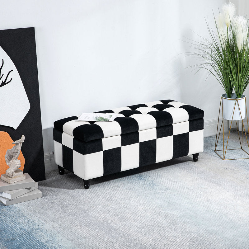 Black and white checkered ottoman in a room with decor elements.