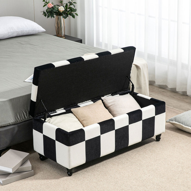 Black and white checkered ottoman with storage compartments in a bedroom setting.