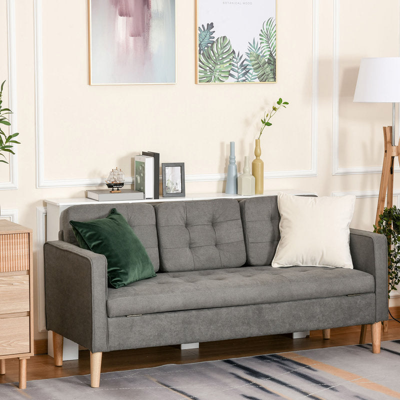 Gray sofa with decorative pillows in a living room setting