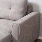 Gray sofa corner with a neutral background