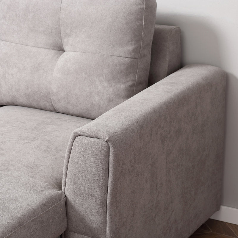 Gray sofa corner with a neutral background