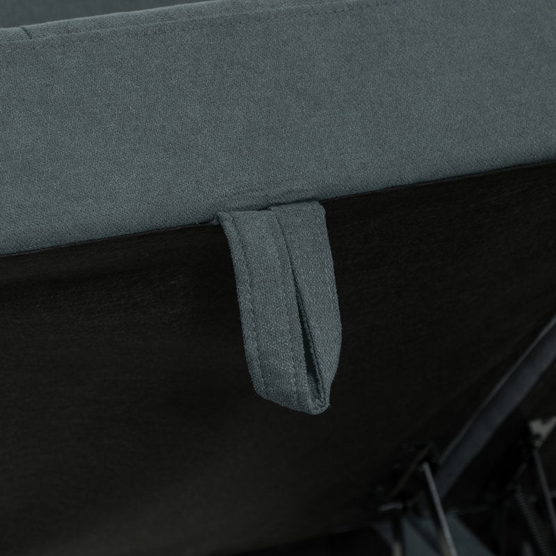 Close-up of a gray fabric surface with a small pocket detail.