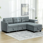 Gray sectional sofa in a living room setting with light wood flooring and white walls.
