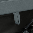 Close-up of a gray fabric surface with a strap attachment