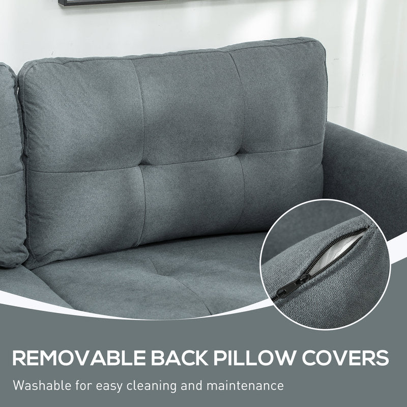 Gray sofa with removable back pillow cover feature, close-up of zipper.