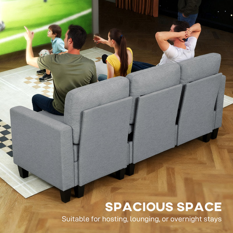 Gray sectional sofa with people sitting on it, watching TV in a living room.