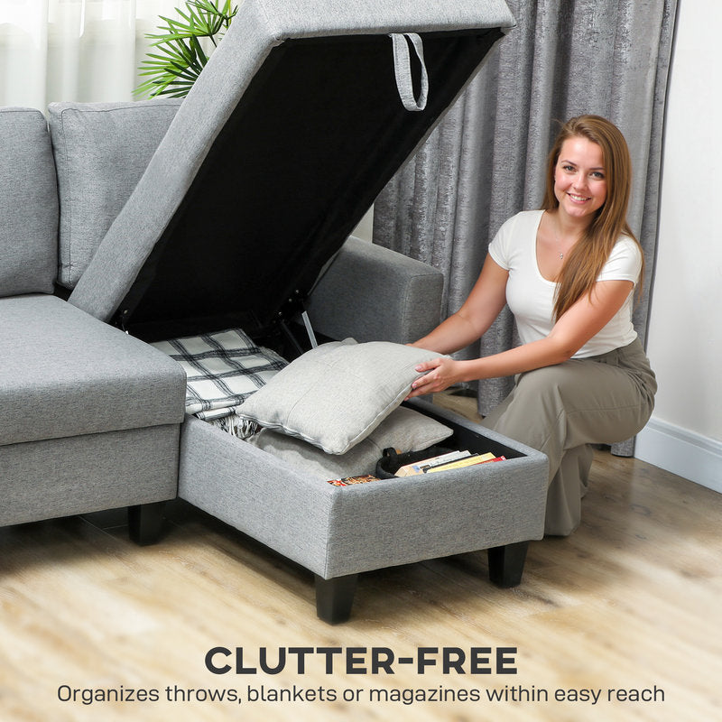 Woman organizing a gray sectional sofa with storage compartment, text 'CLUTTER-FREE'.