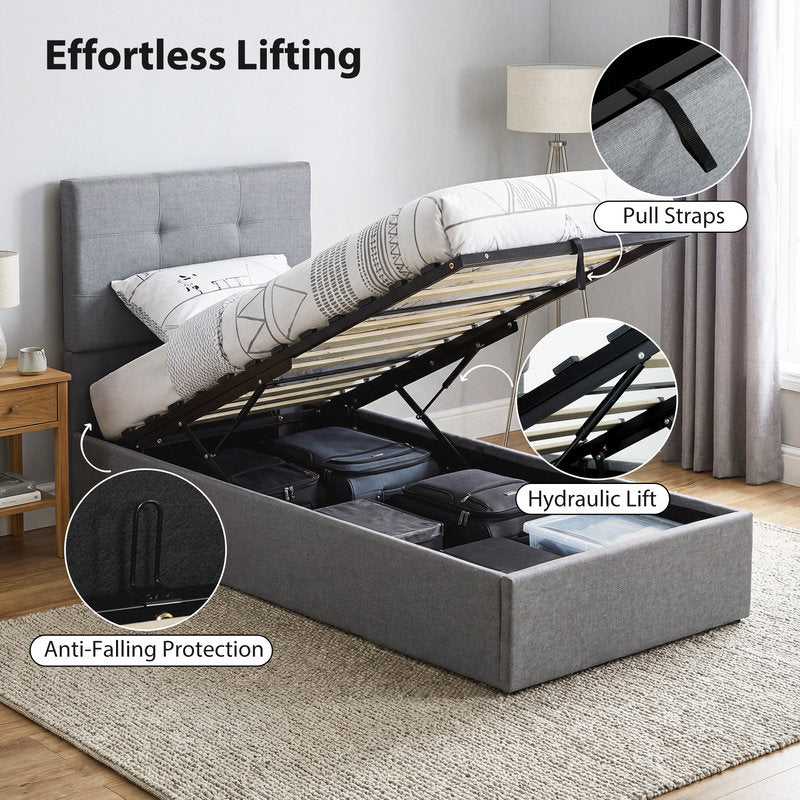 Gray upholstered bed with lifting mechanism in a room setting