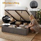 Woman using a gas lift bed with storage compartments in a room.