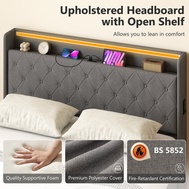 Gray upholstered headboard with open shelf on a bed, featuring BS 5852 fire-retardant certification.