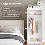 Closet with a large wardrobe, top shelf for folded clothes, and full-length hanging rail.