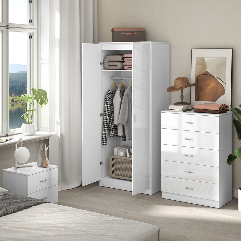 White wardrobe and dresser set in a bedroom with clothes and accessories.