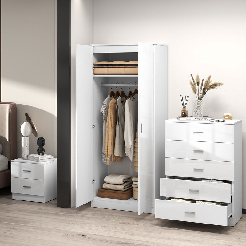 White wardrobe with open door showing clothes, next to a white dresser with drawers in a bedroom setting.