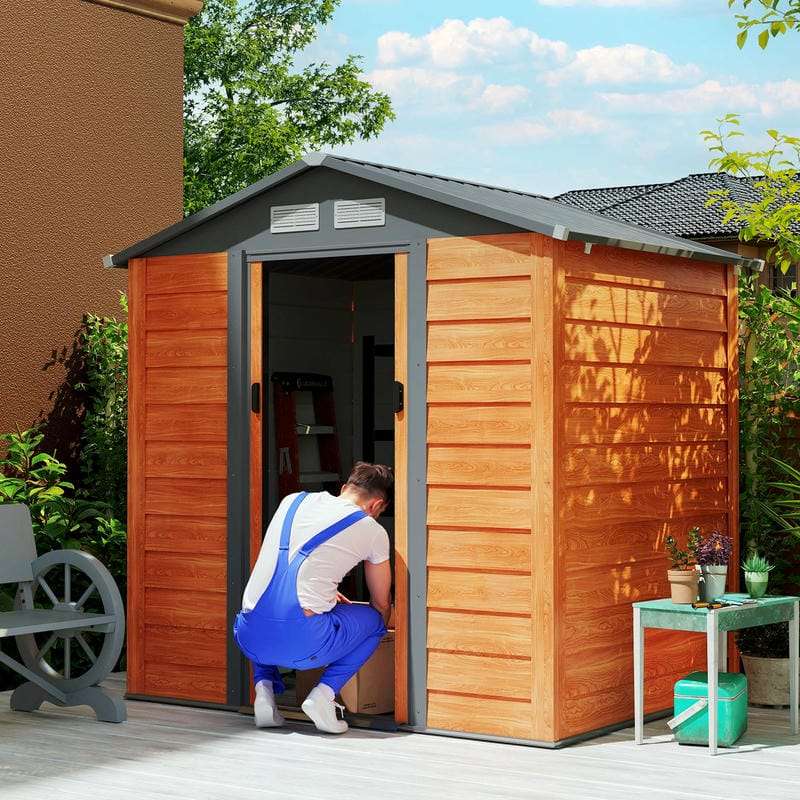 Man opening brown wood-effect galvanised steel garden shed on a sunny day