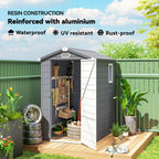 Resin storage shed with open door, showing tools and plants, against a green fence and blue sky.