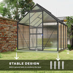 Greenhouse with stable design feature highlighted on a grassy area with trees and a brick wall in the background.