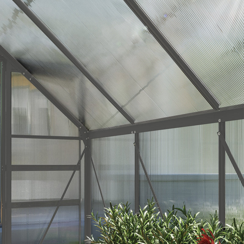 Greenhouse with transparent roof and walls, plants visible inside.