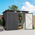 Gray storage shed with a white door, outdoor setting with plants and blue sky.