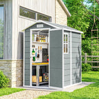 Grey garden shed with open doors, showing tools and equipment, in a backyard setting.