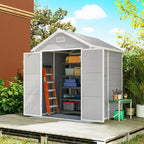 Gray storage shed with open doors on a wooden deck, surrounded by greenery.