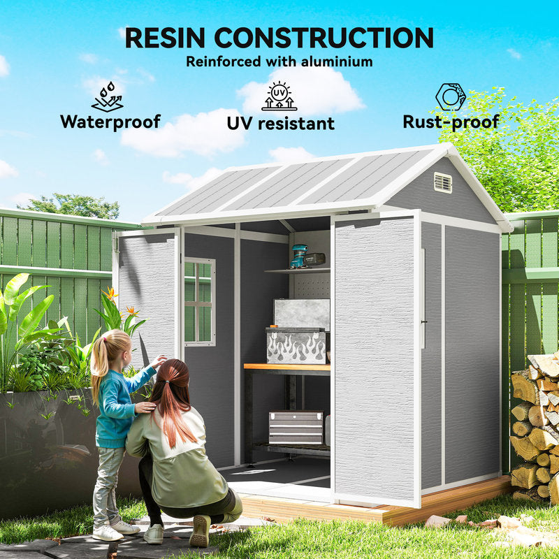 Resin construction shed with two people interacting in a garden setting, featuring waterproof, UV-resistant, and rust-proof properties.