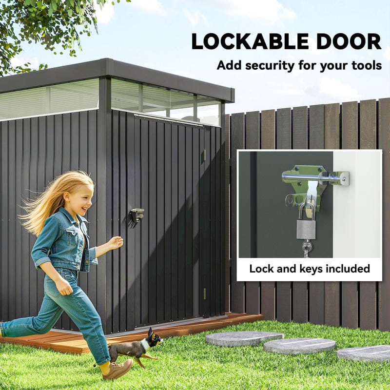 Dark grey galvanised steel garden shed with lockable wide door in a garden setting