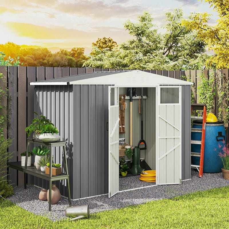 Light grey galvanised steel garden shed with open door in a backyard setting