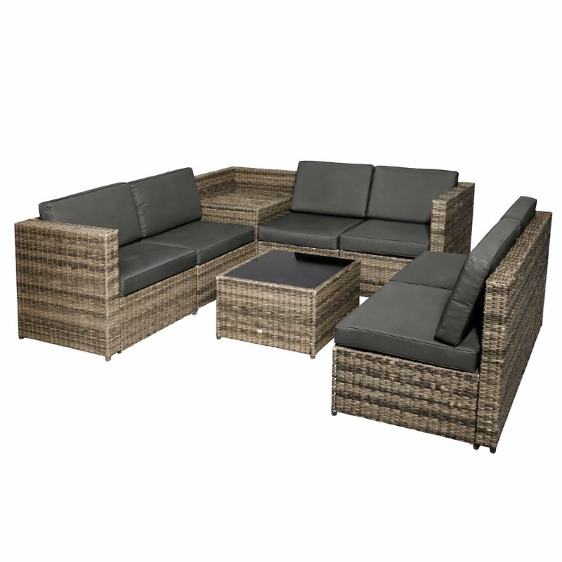 Outdoor furniture set with wicker design and dark cushions on a white background