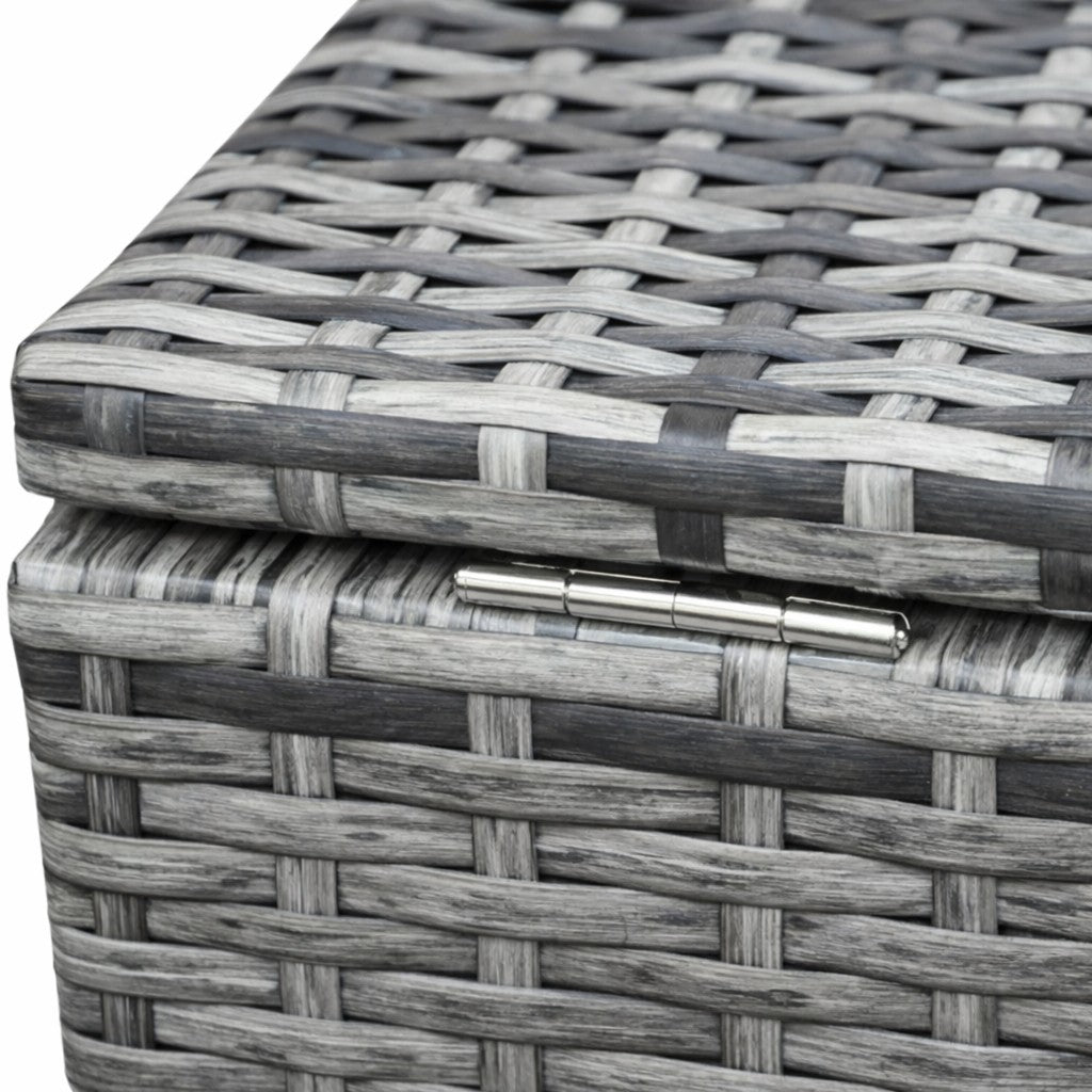Close-up of a woven basket with a metallic latch on a white background