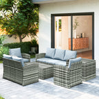 Outdoor patio furniture set with cushions on a patio area.