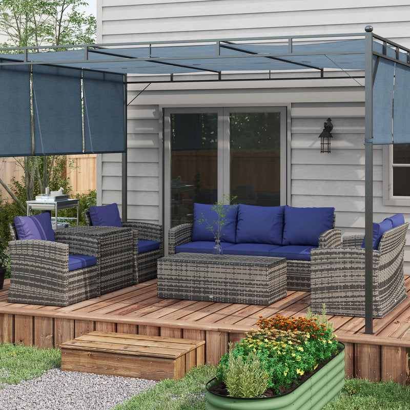 Outdoor patio with wicker furniture, blue cushions, and a pergola on a wooden deck.