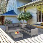 Outdoor patio with gray sectional sofa, coffee table, and decorative items on a patio deck.