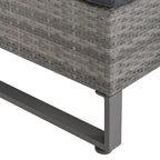 Close-up of a gray wicker outdoor chair corner with metal legs on a white background