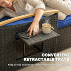 Person using a retractable tray on a wicker chair with a cup of coffee and phone.