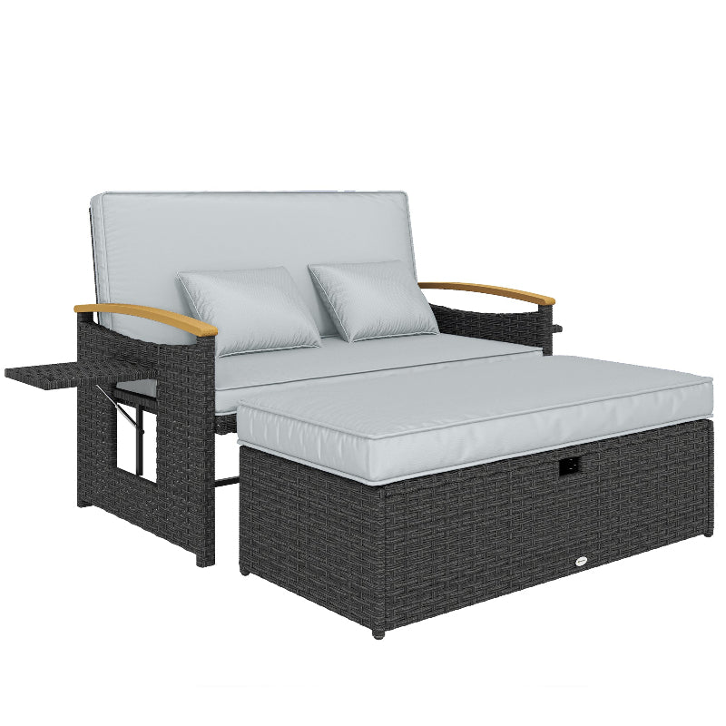 Outdoor lounge chair with gray cushions and a small table on a white background